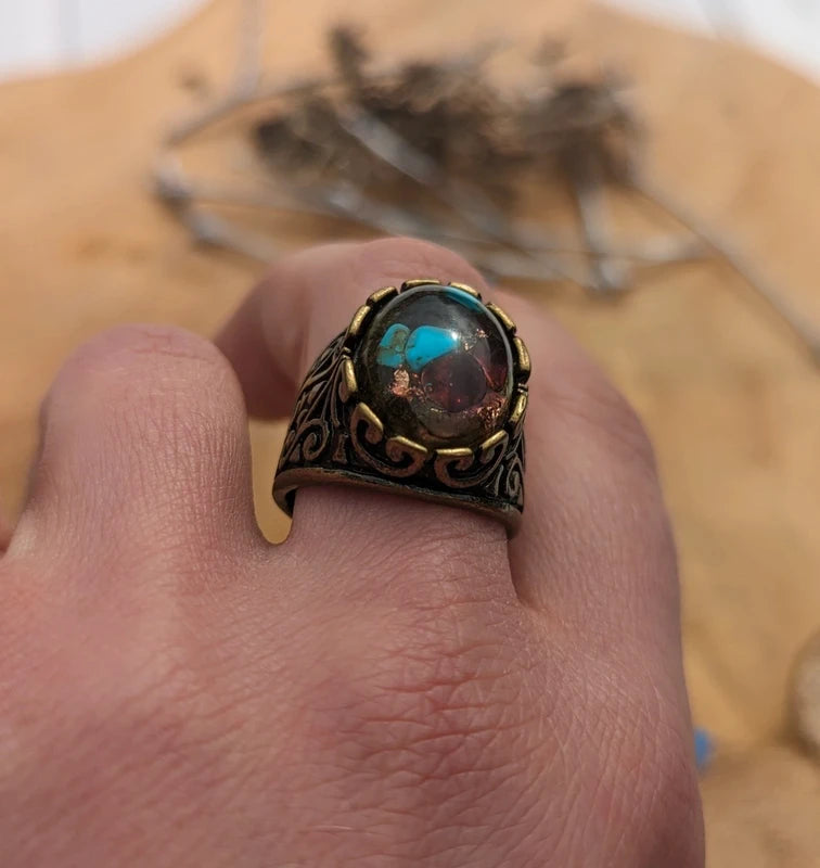 Close-up of garnet turquoise and moss inside clear resin ring, handmade artisan jewelry EL Creations