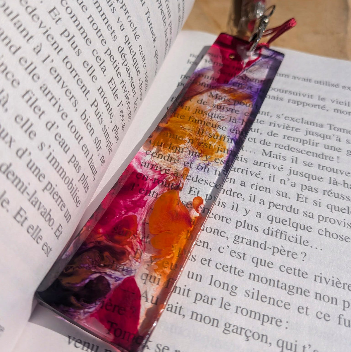 Handmade crimson and purple resin bookmark in open book spine view – EL-Creations