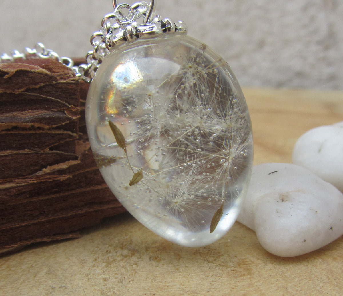 Oval dandelion seed pendant in clear resin on silver chain EL-Creations