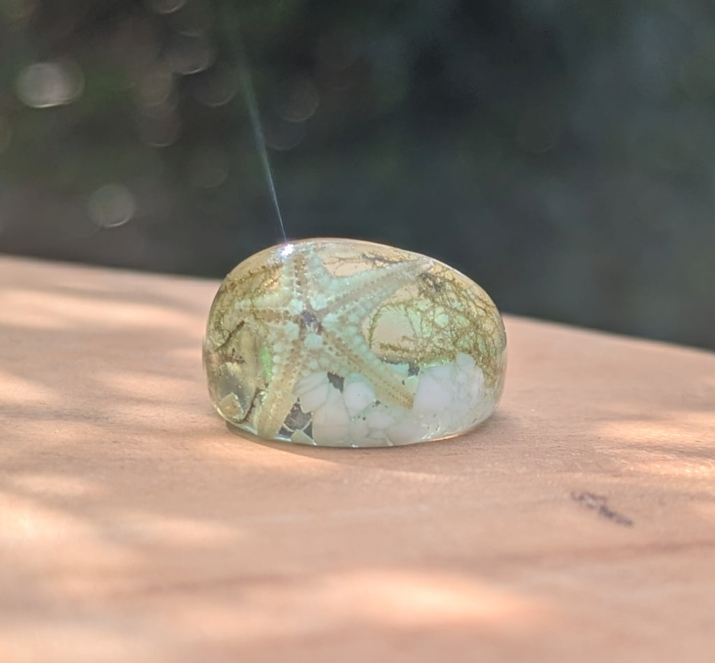 Decorative stone with intricate patterns on a wooden surface