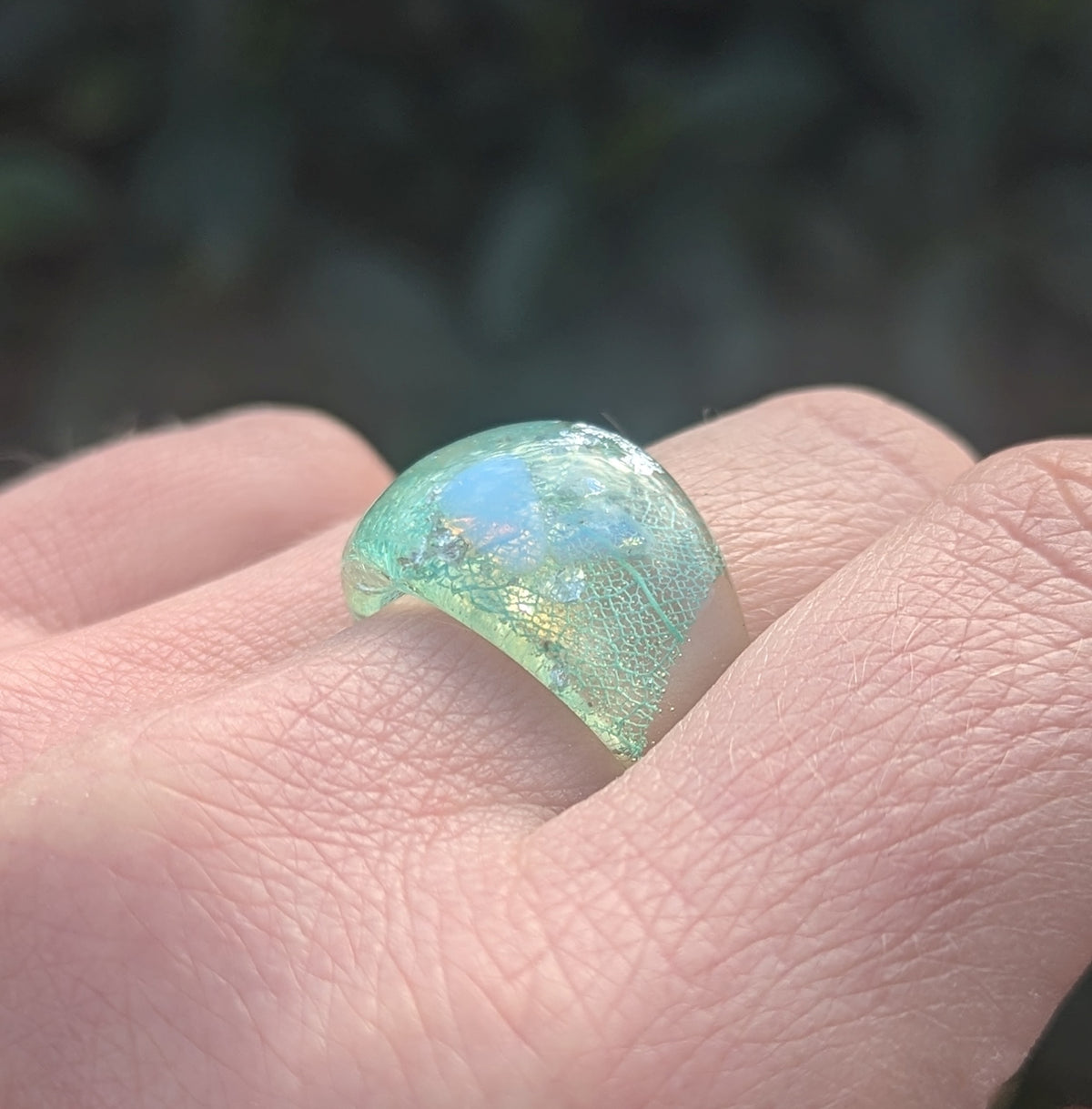 Crystal clear resin ring with aquamarine leaf and silver flakes by EL-Creations