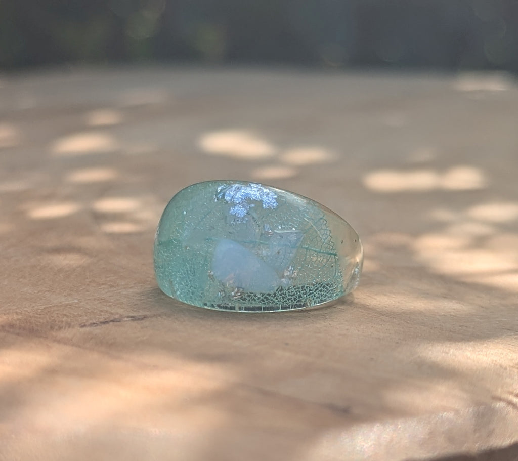 Aquamarine resin ring detail - showing leaf inclusion