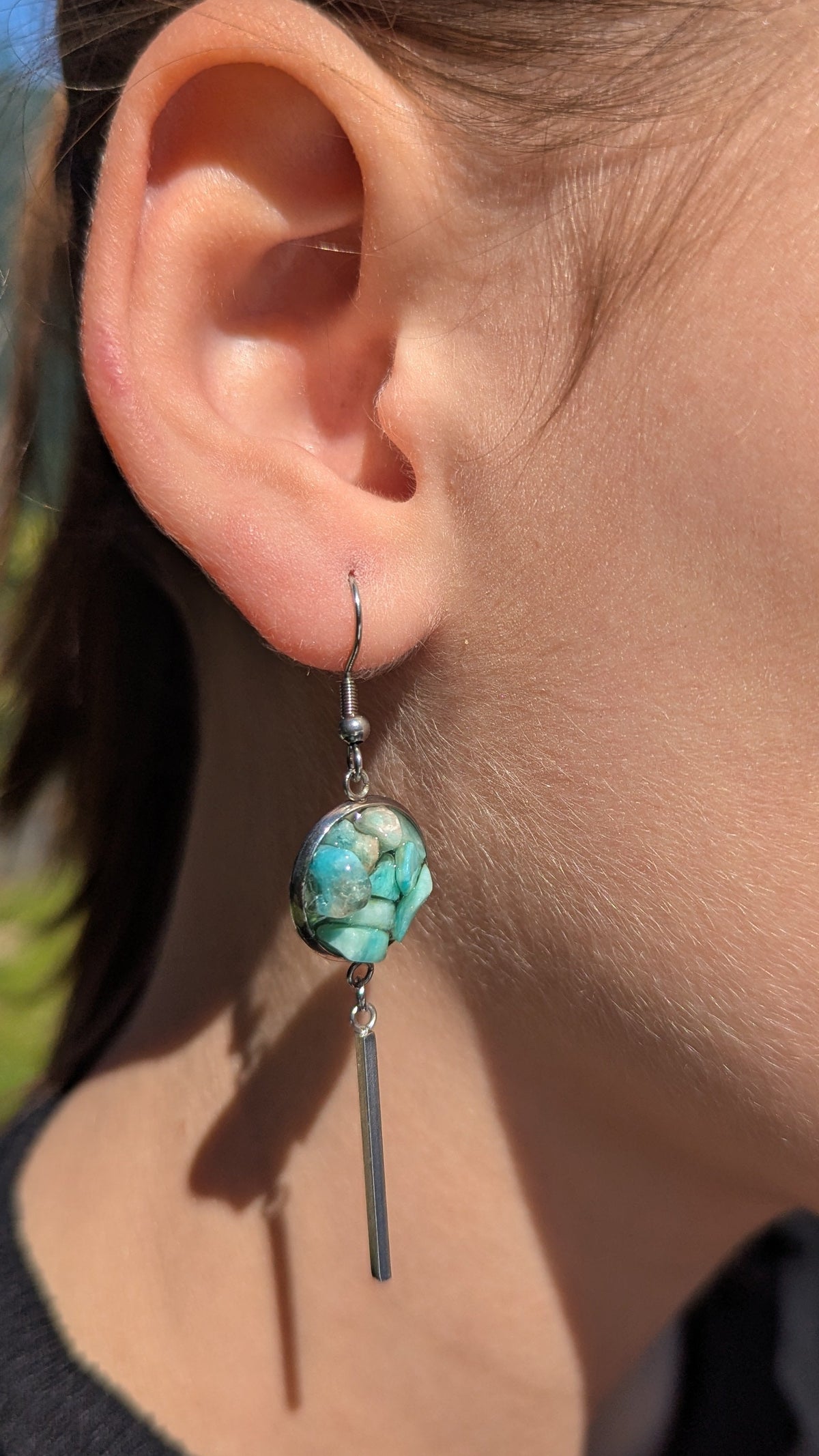 Amazonite resin bar earrings worn on ear, turquoise-green gemstone jewelry EL Creations Belgium