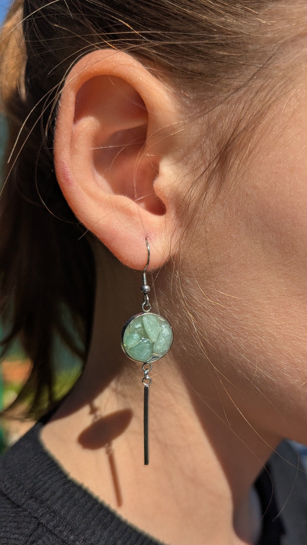 Green aventurine resin bar earrings worn on ear, turquoise-green gemstone statement jewelry EL Creations