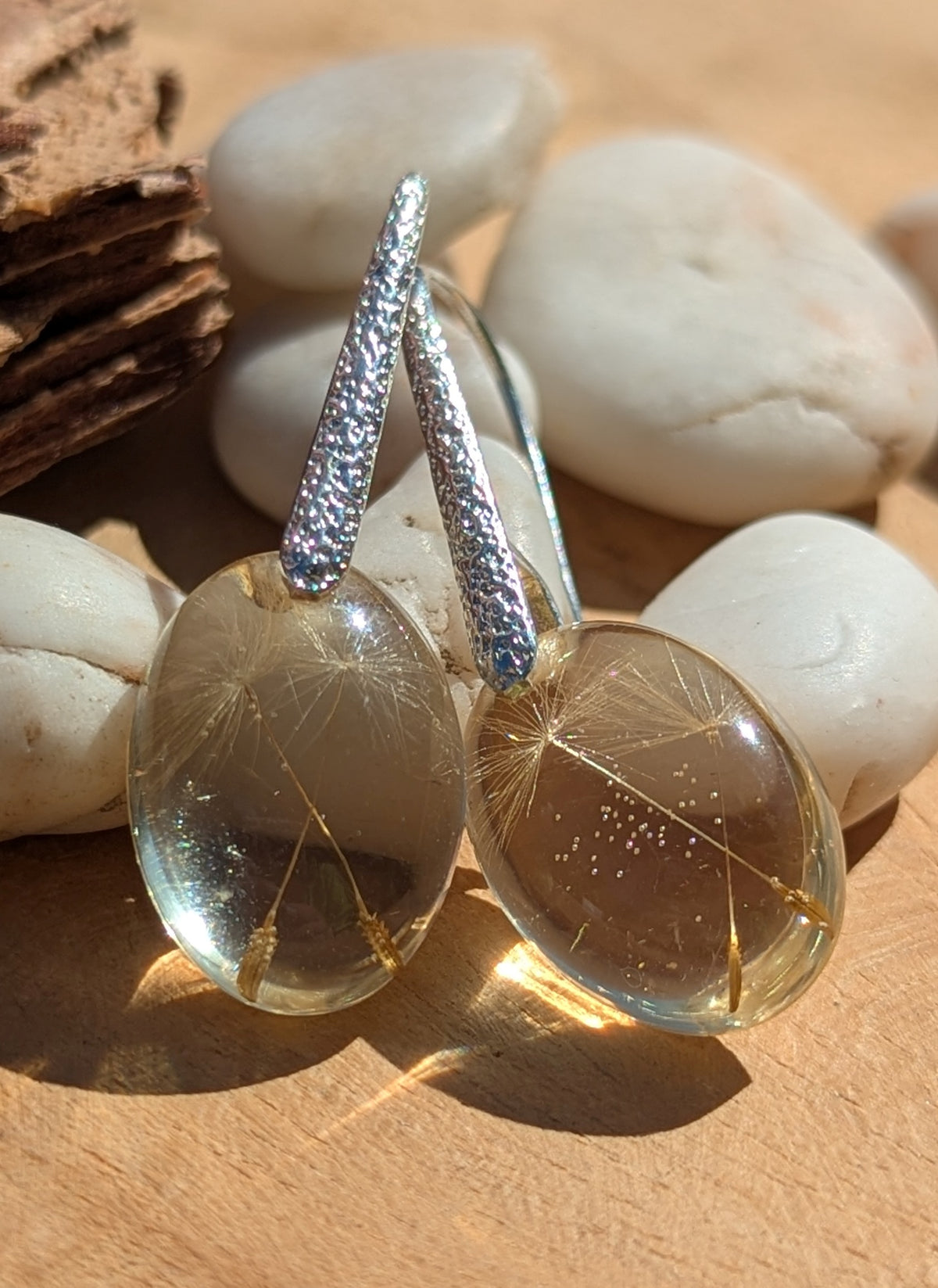 Handmade dandelion earrings on stone surface, fairycore nature jewelry EL Creations