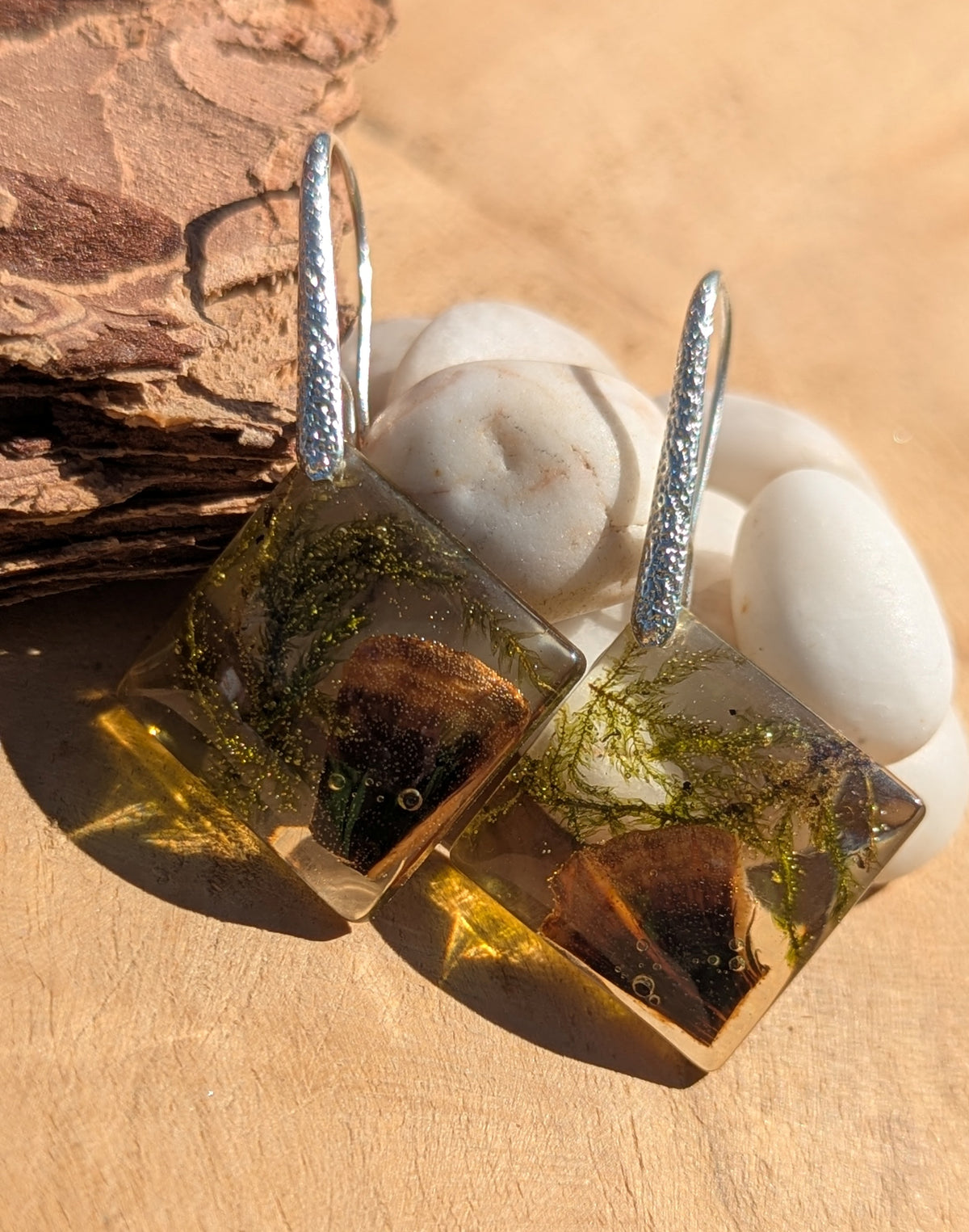 Handmade moss mushroom resin earrings worn on ear, cottagecore nature jewelry EL Creations