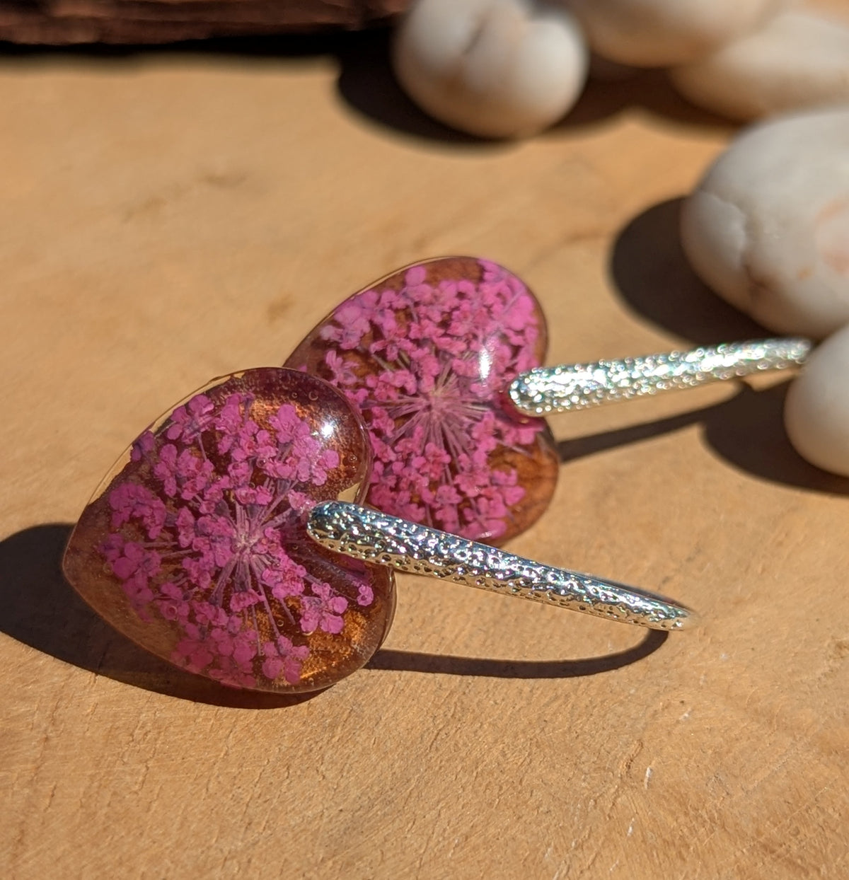 Handmade purple botanical heart earrings worn on ear, nature jewelry EL Creations