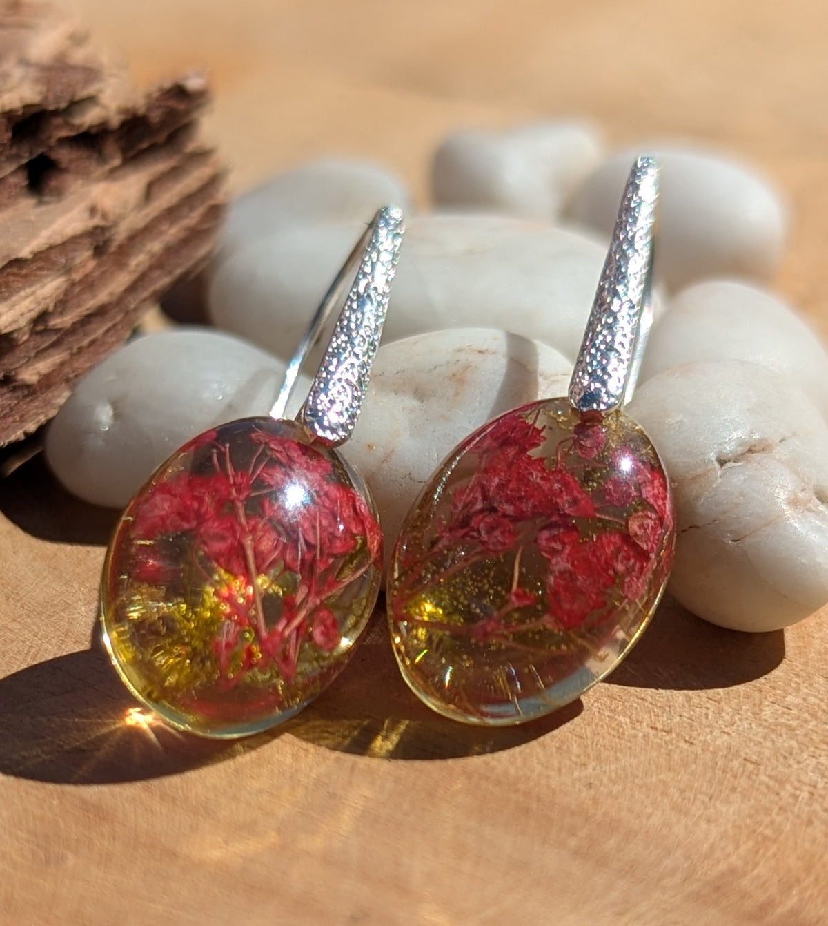 Red flower moss oval resin earrings 13x18mm on stone surface, unique nature jewelry EL Creations