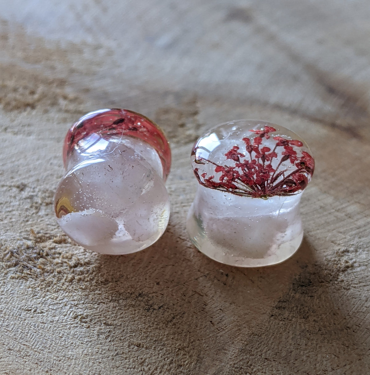 Handmade stretched ear plugs featuring rose quartz and preserved red flower EL-Creations
