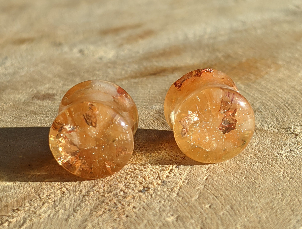 Handmade stretched ear plugs featuring carnelian and copper resin design EL-Creations