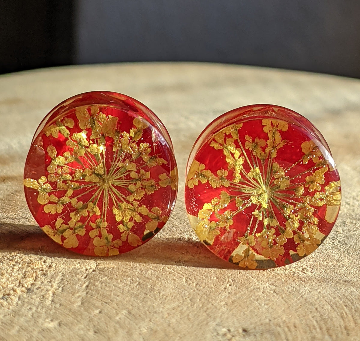 Handmade stretched ear plugs featuring red tulip leaf and yellow petals EL-Creations