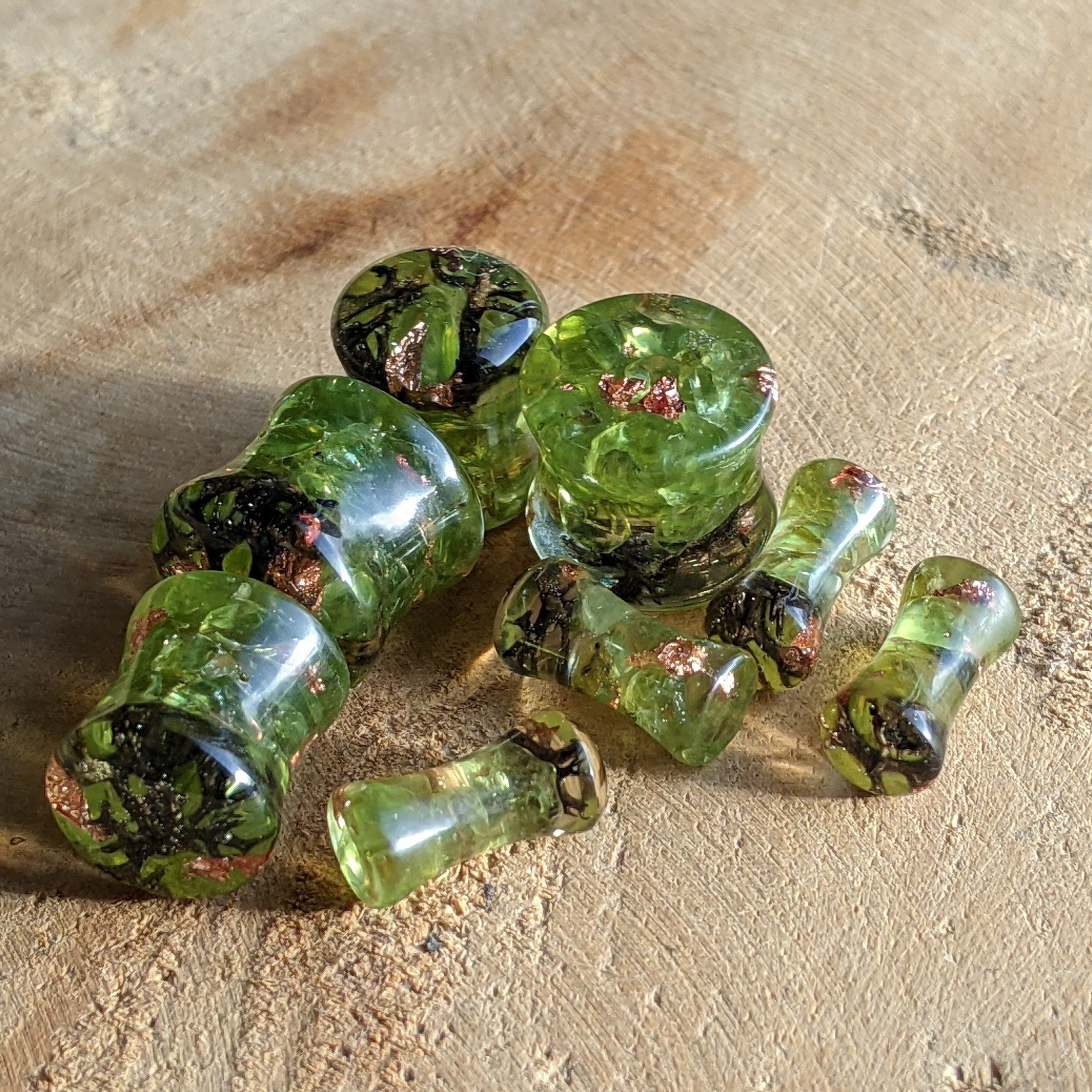 Green crystal beads on a textured surface