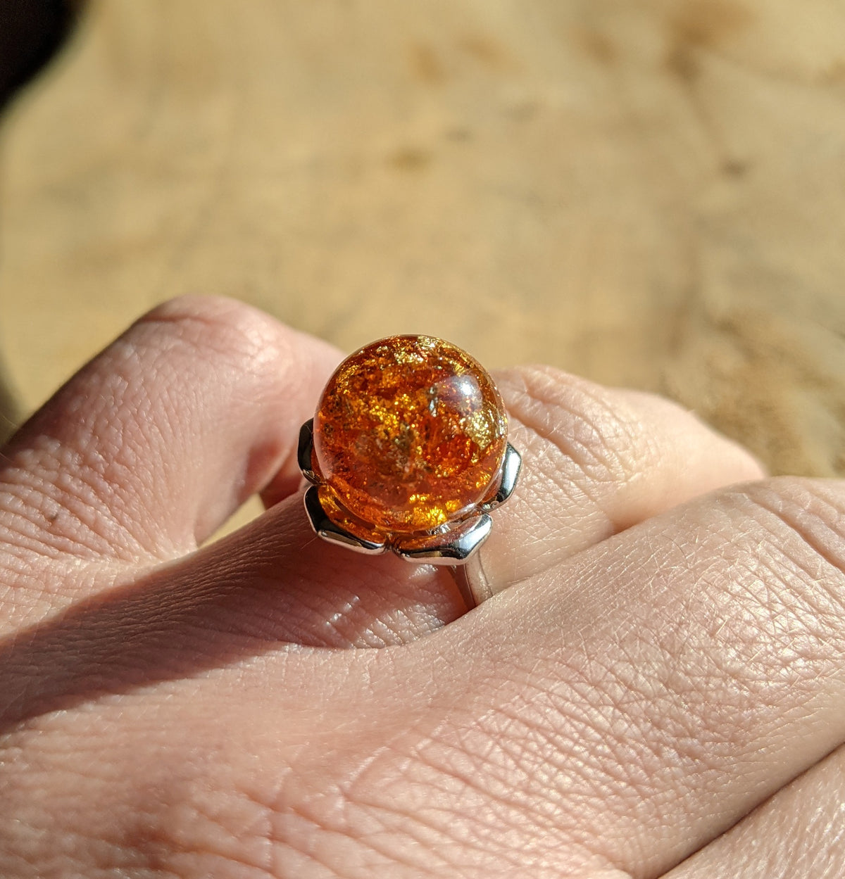 Handmade amber resin ring top view – golden amber sphere, adjustable band – EL-CreationS