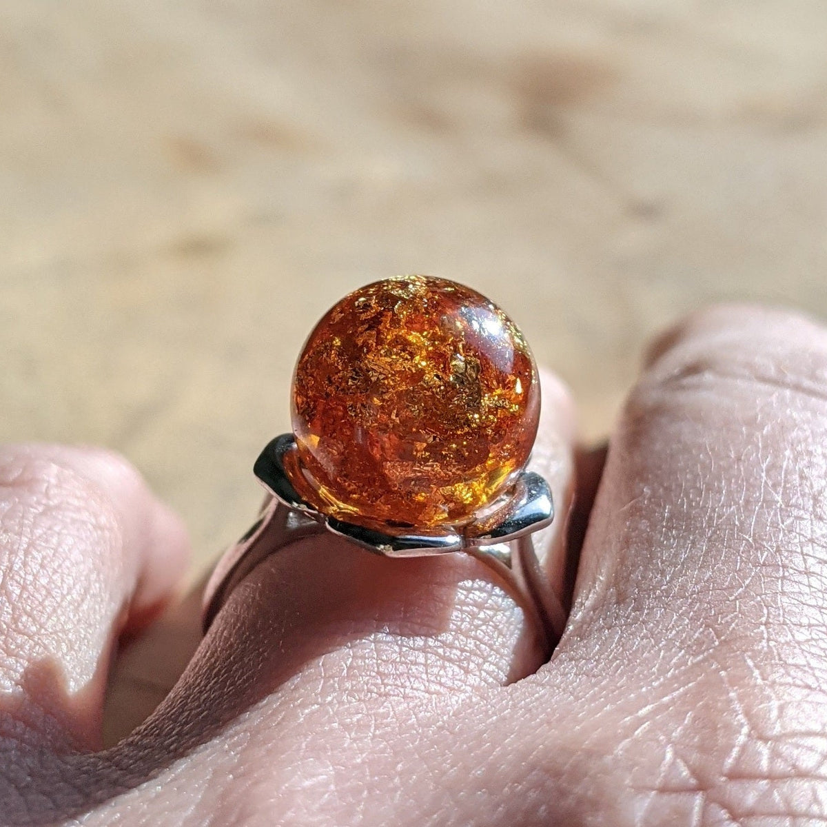Amber resin ball ring – clear sphere with warm amber tones, adjustable silver band – EL-CreationS