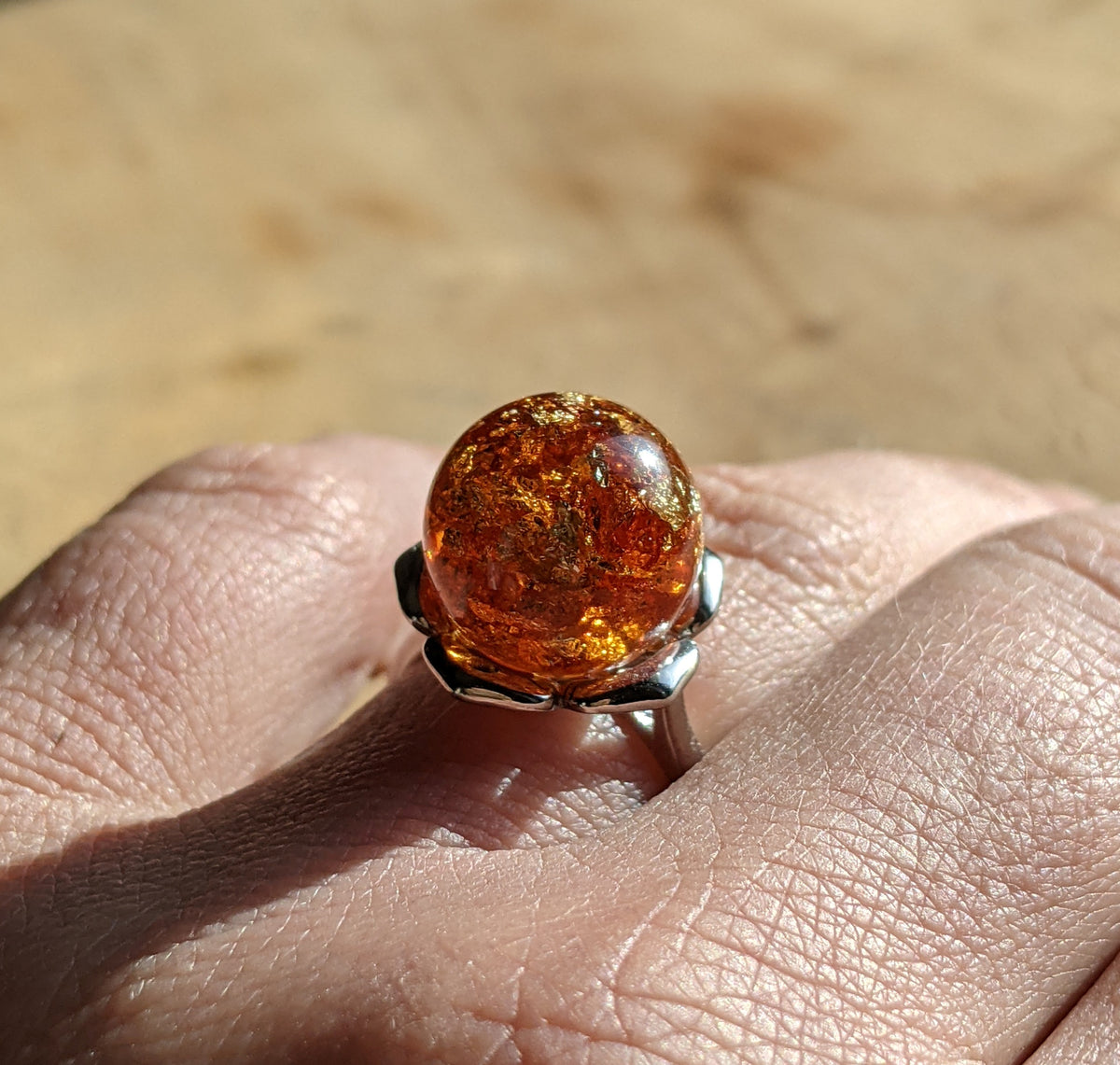 Amber ball ring side view – warm golden resin sphere, adjustable fit – EL-CreationS