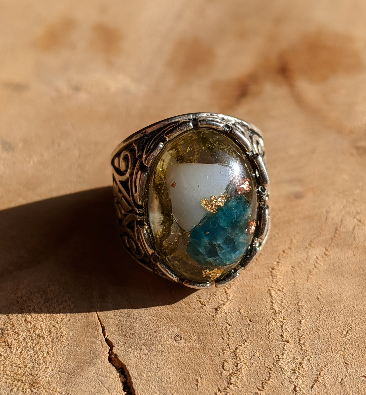 Nature-inspired gemstone ring with blue tourmaline and forest moss in resin, side view — EL-Creations