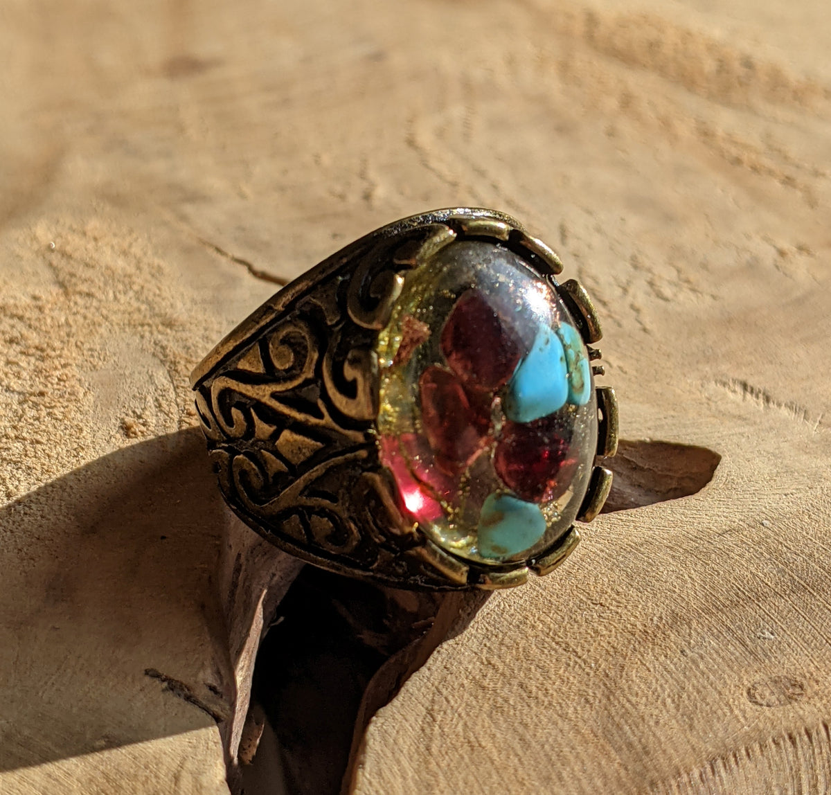 Adjustable garnet turquoise ring with copper flakes and moss in resin, side view, EL Creations