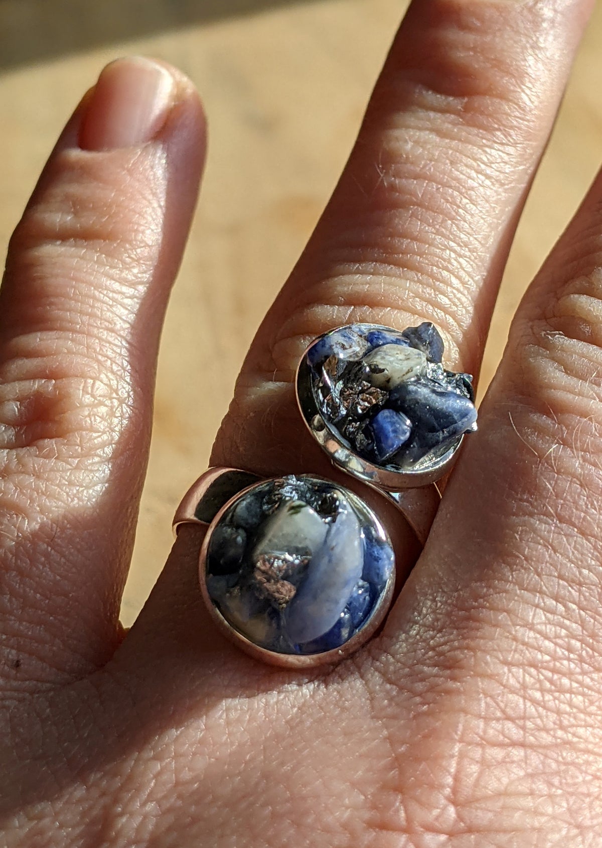 Adjustable blue crystal sodalite ring worn on finger, nature gemstone jewelry Belgium