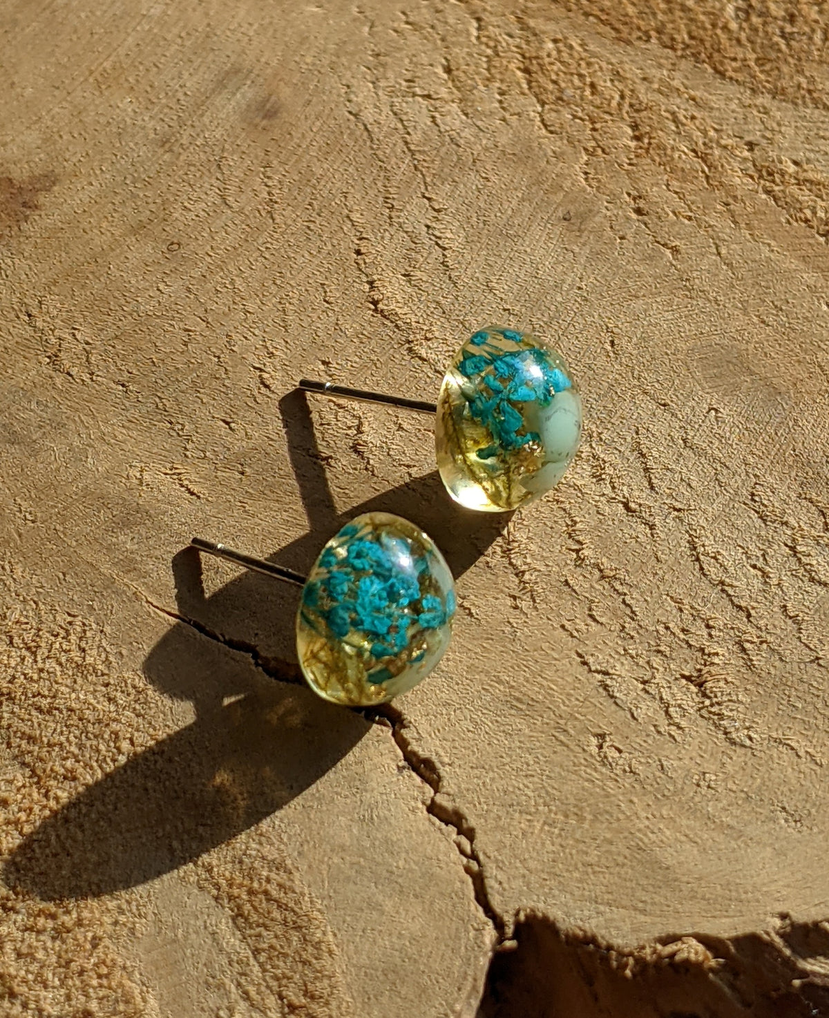 Handmade aquamarine gemstone stud earrings worn on ear, everyday nature jewelry EL Creations Belgium