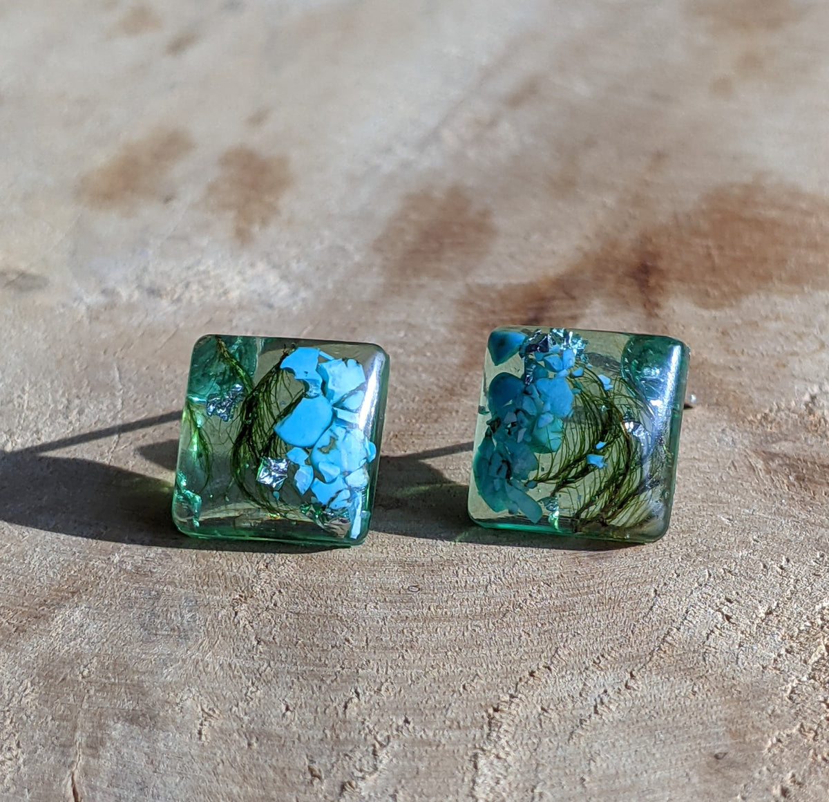 Green-tinted turquoise moss resin square stud earrings on beige surface, unique jewelry EL Creations