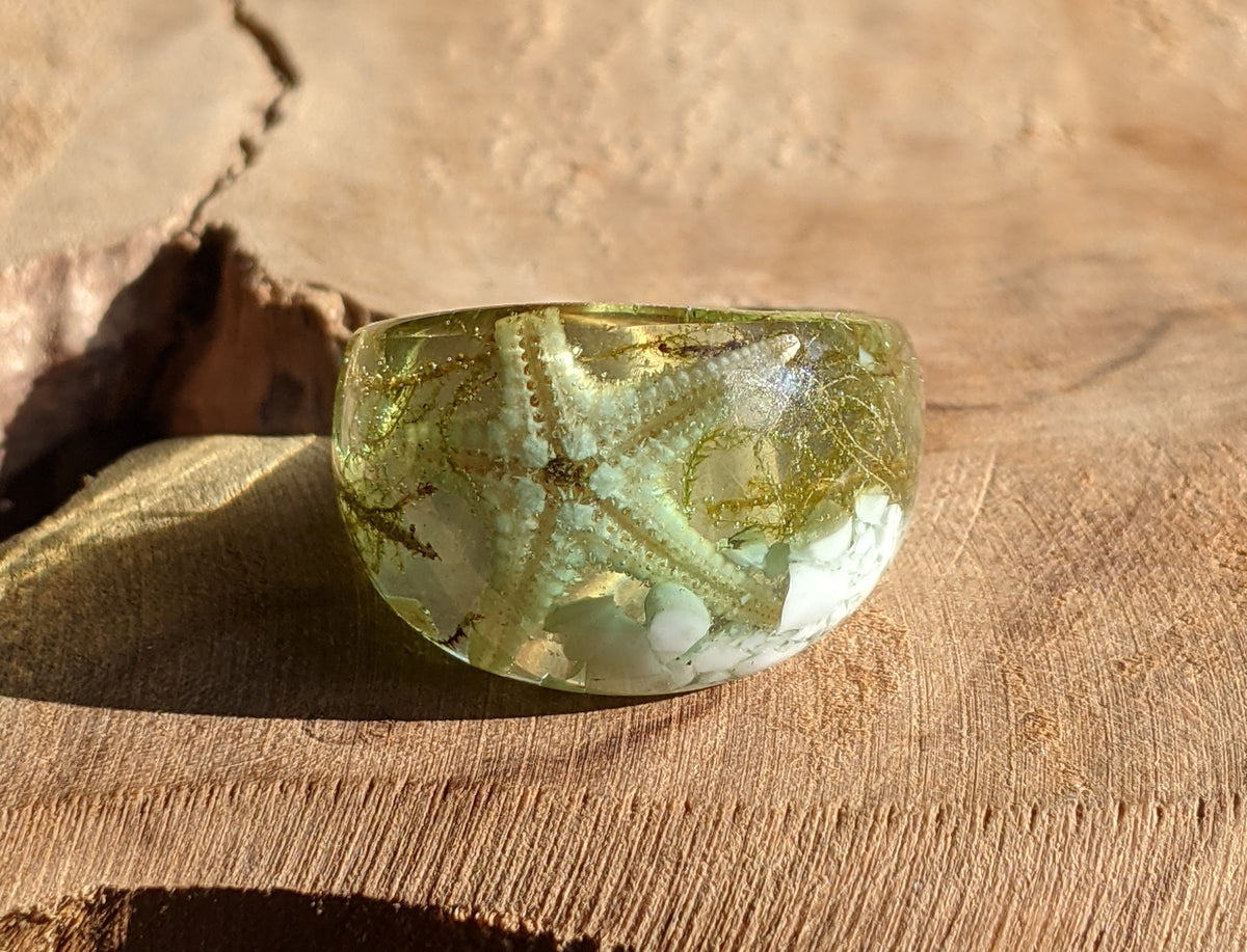 Ocean inspired resin ring featuring a real starfish and natural white stone by EL-Creations