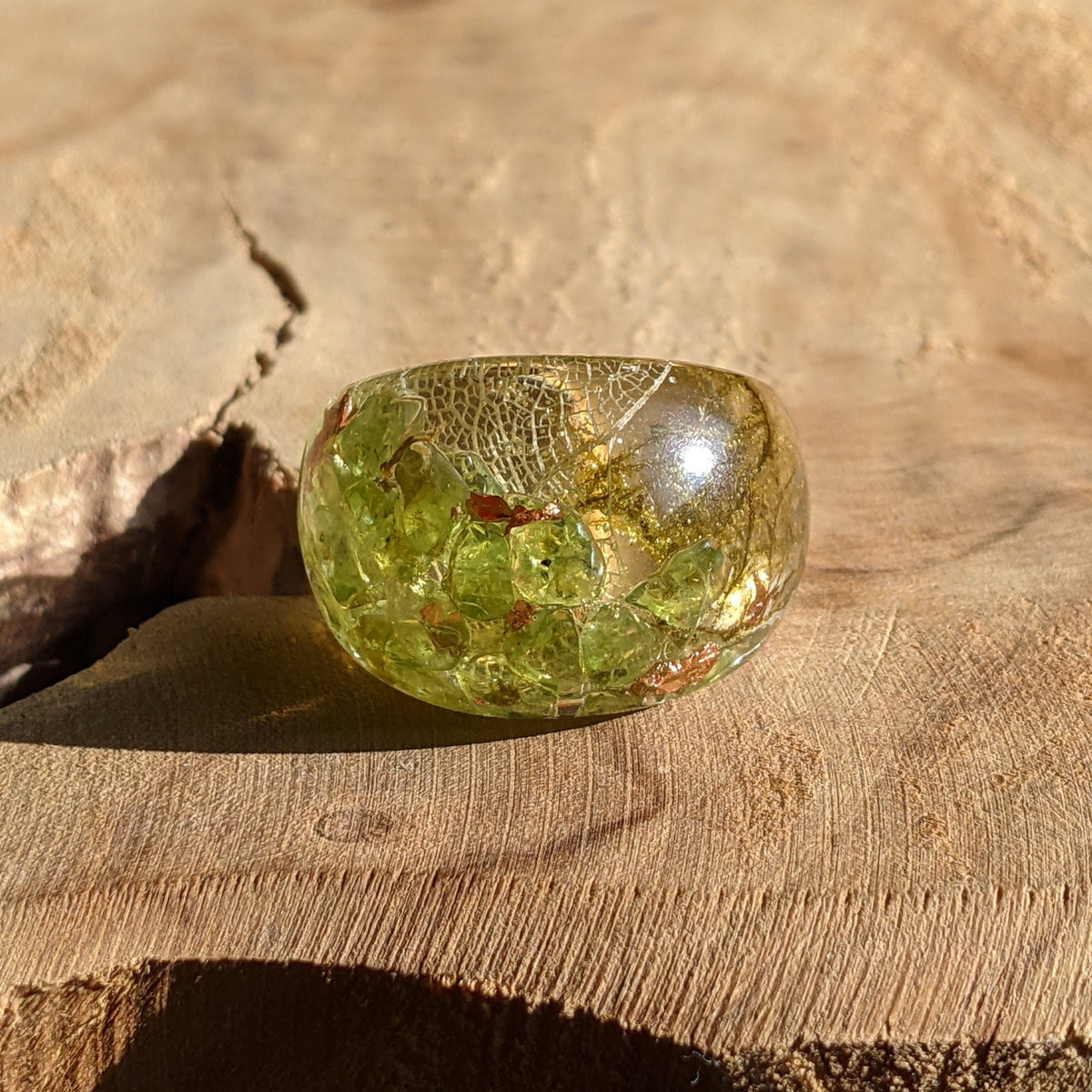 Peridot resin ring with skeleton leaf and copper flakes by EL-Creations