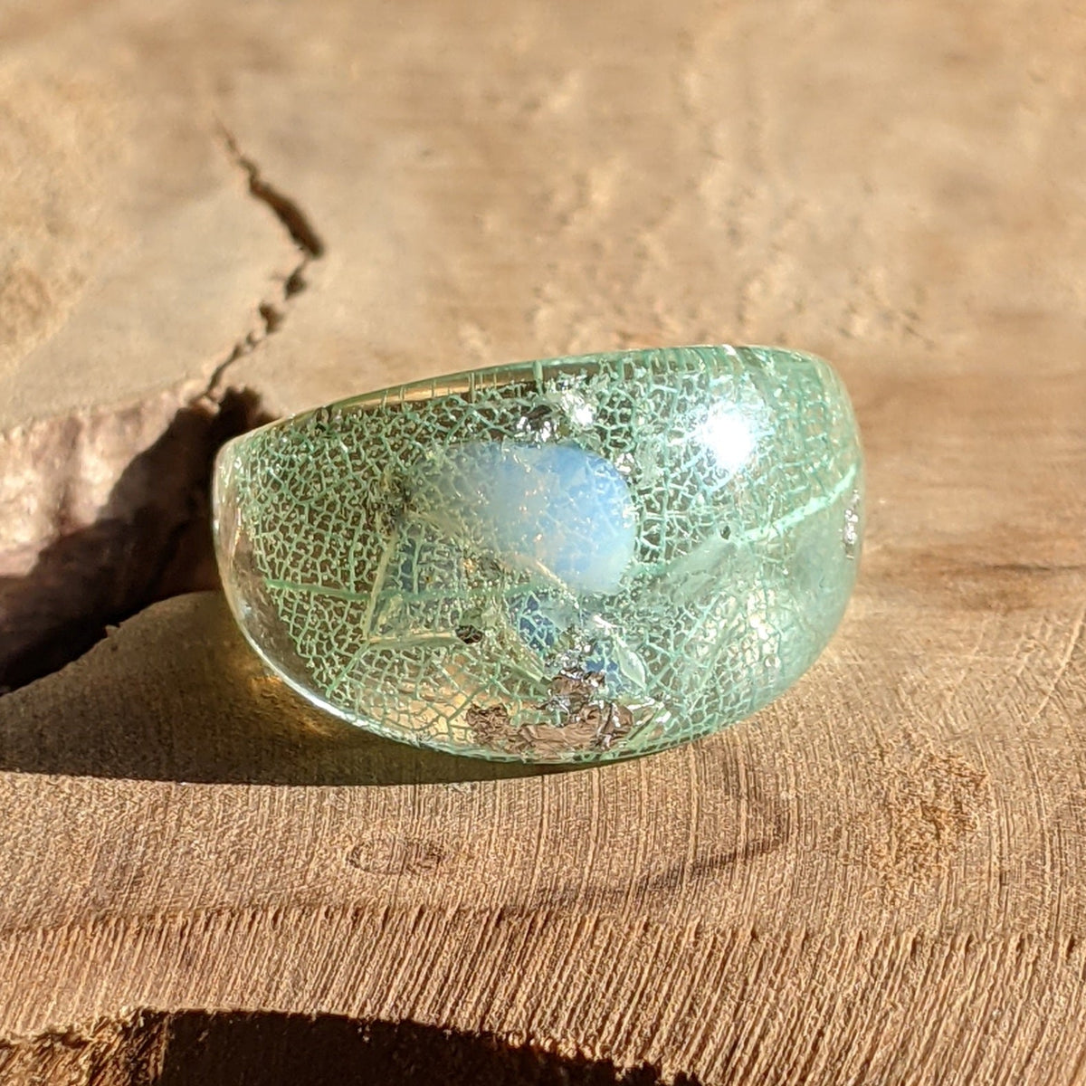 Handmade aquamarine resin ring with leaf and silver flakes by EL-Creations
