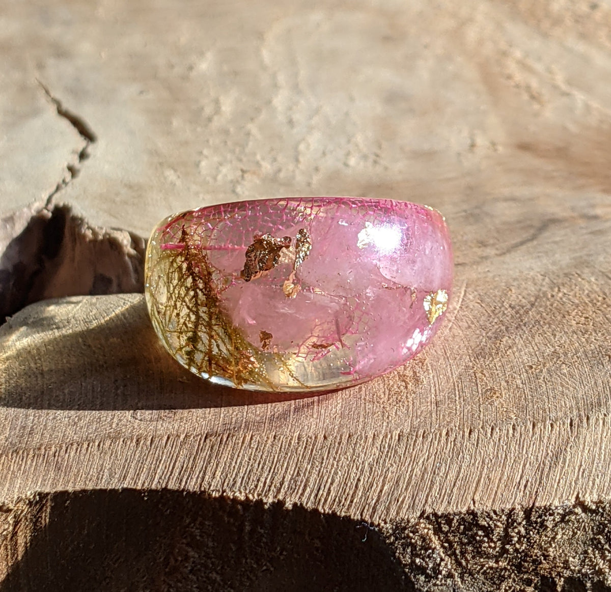 Botanical resin ring featuring real pink flowers and natural moss by EL-Creations