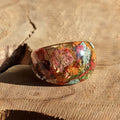 Rainbow multicolor flower resin ring - top view on wood