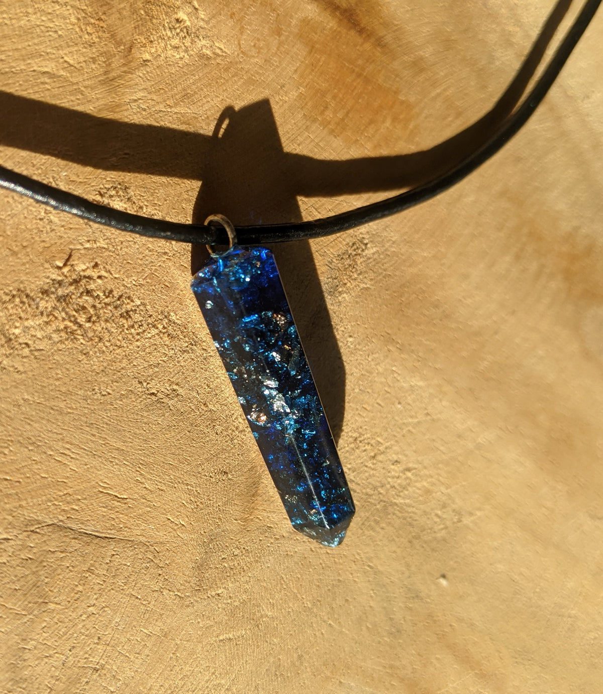 Deep blue handmade resin pendant with reflective metallic flakes EL-Creations