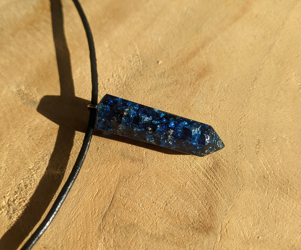 Close-up of blue crystal resin pendant with metallic shimmer EL-Creations