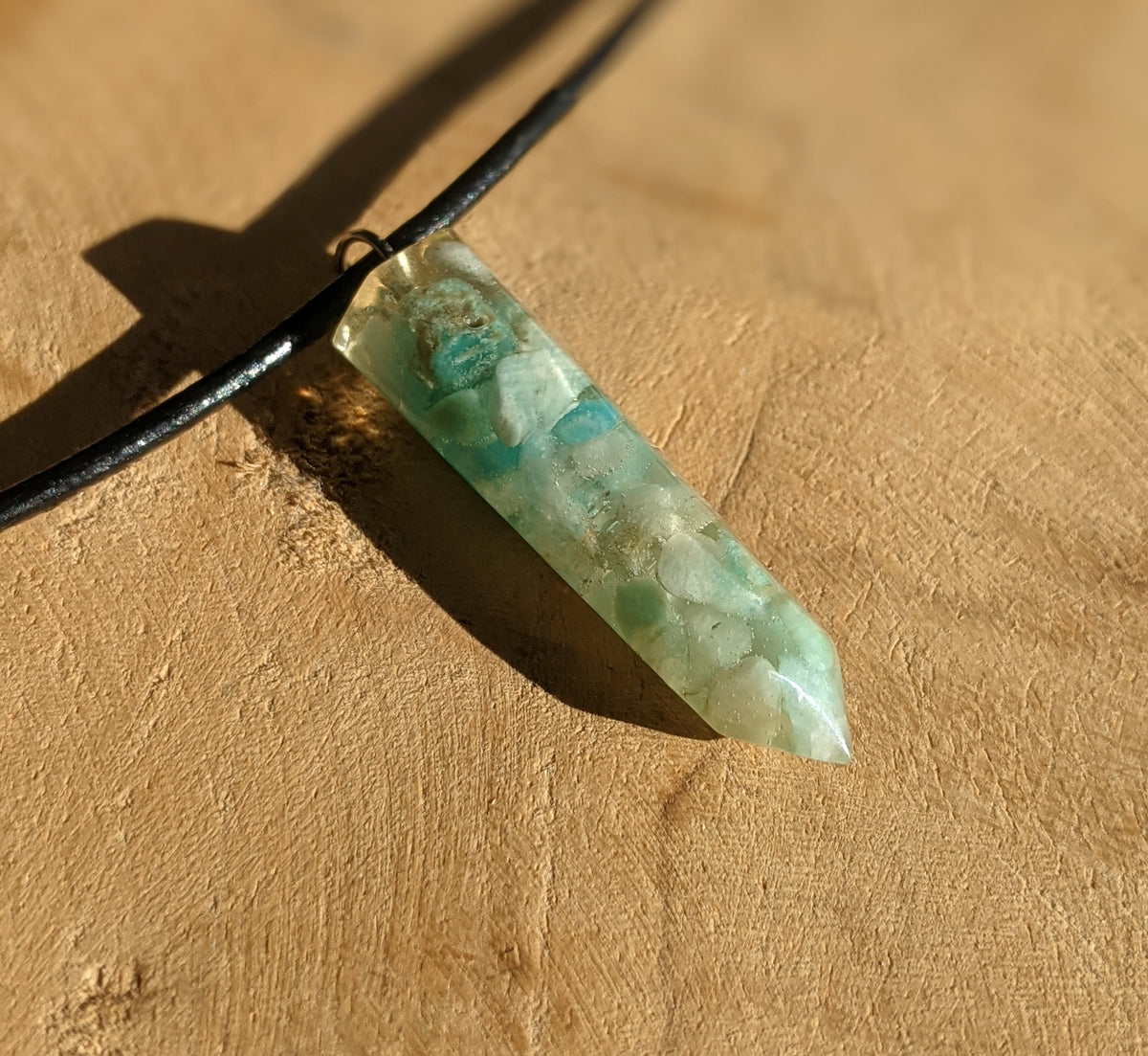 Natural amazonite stones preserved inside clear resin crystal point pendant EL-Creations