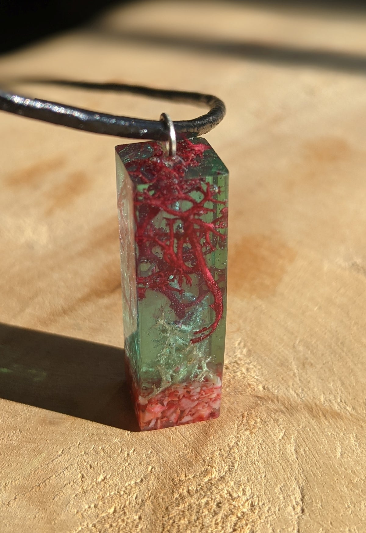 Botanical resin necklace featuring preserved moss and red coral EL-Creations