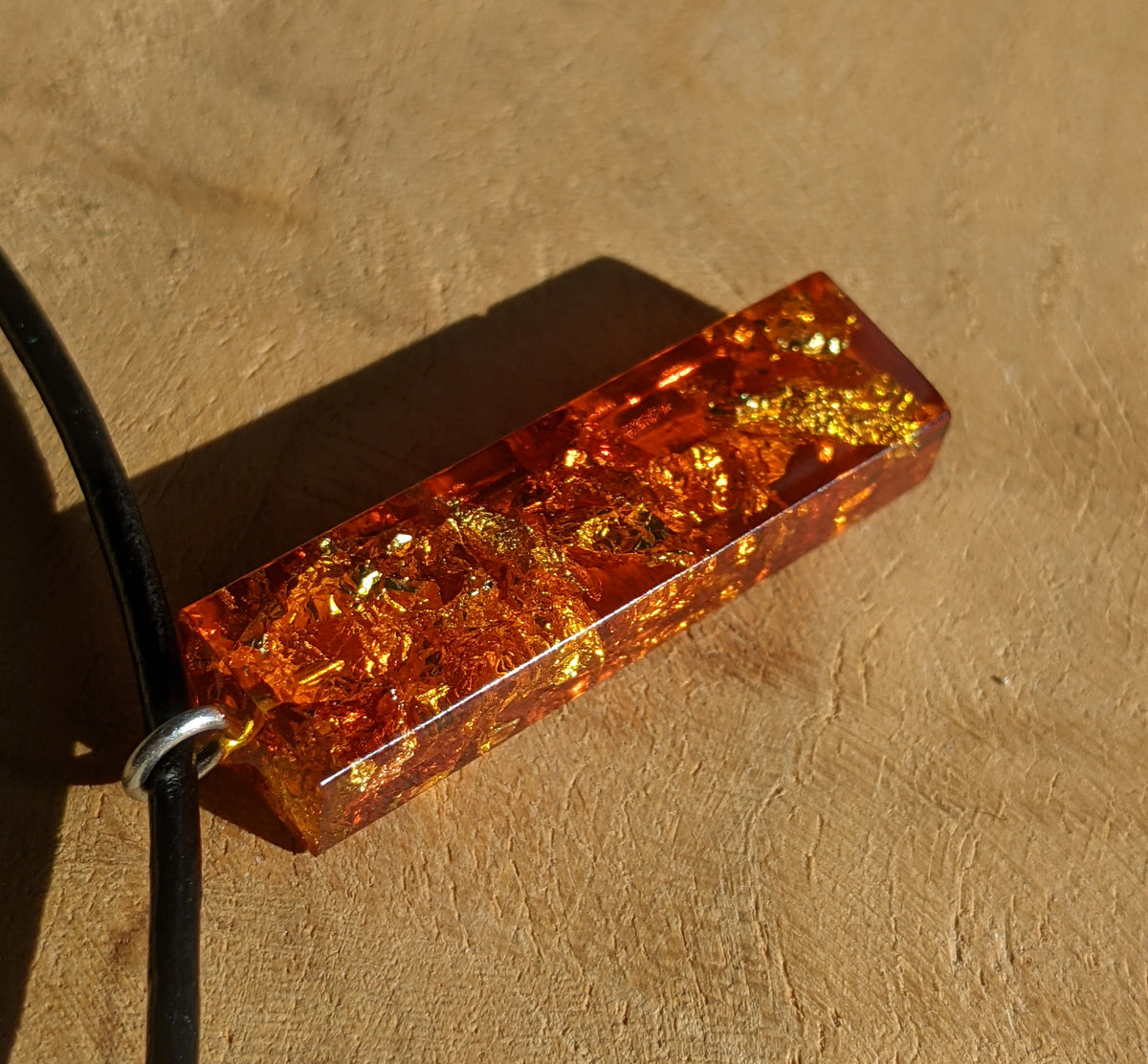 Handmade amber resin pendant necklace with metallic gold flakes and leather cord EL-Creations