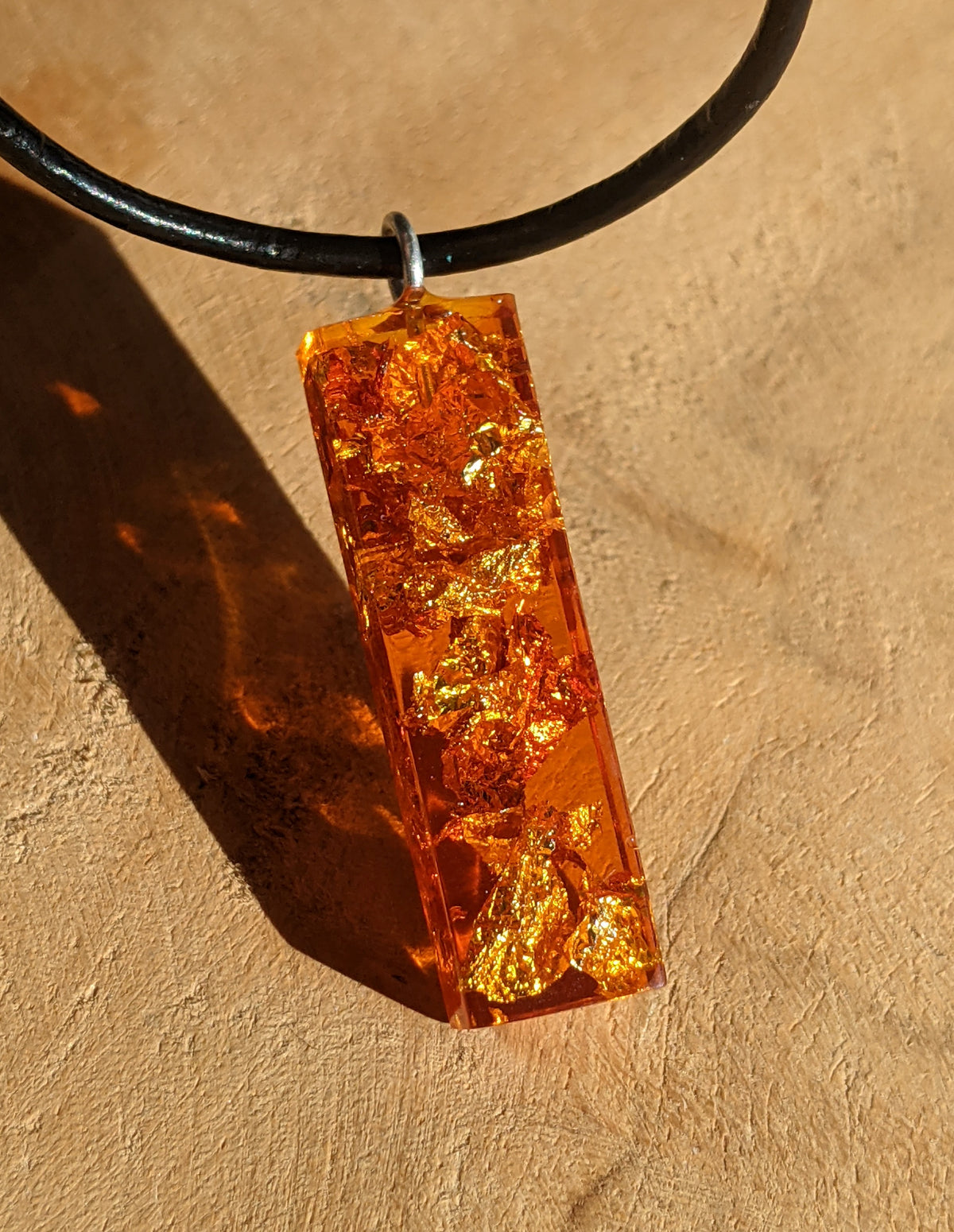 Rectangle resin necklace design with copper flakes and warm amber tones EL-Creations