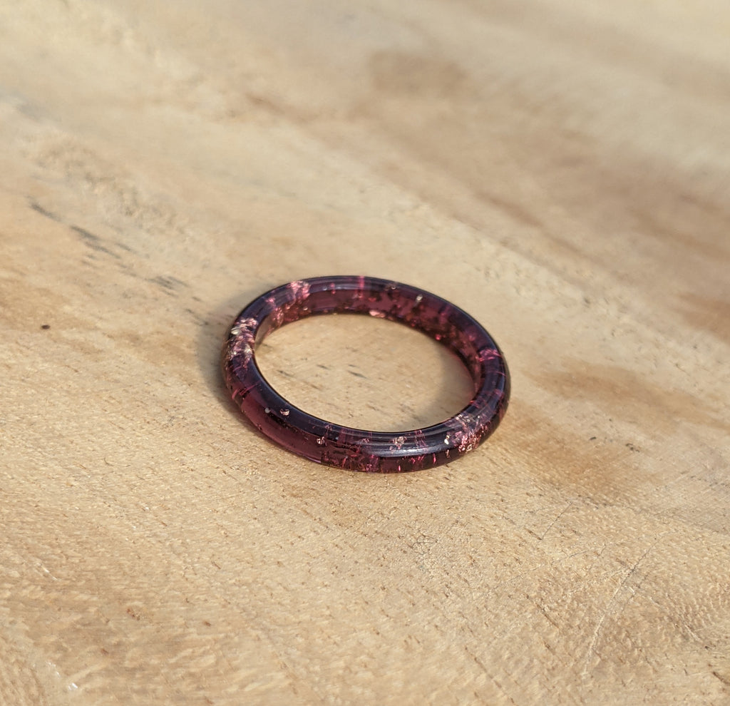 Purple ring on a wooden surface