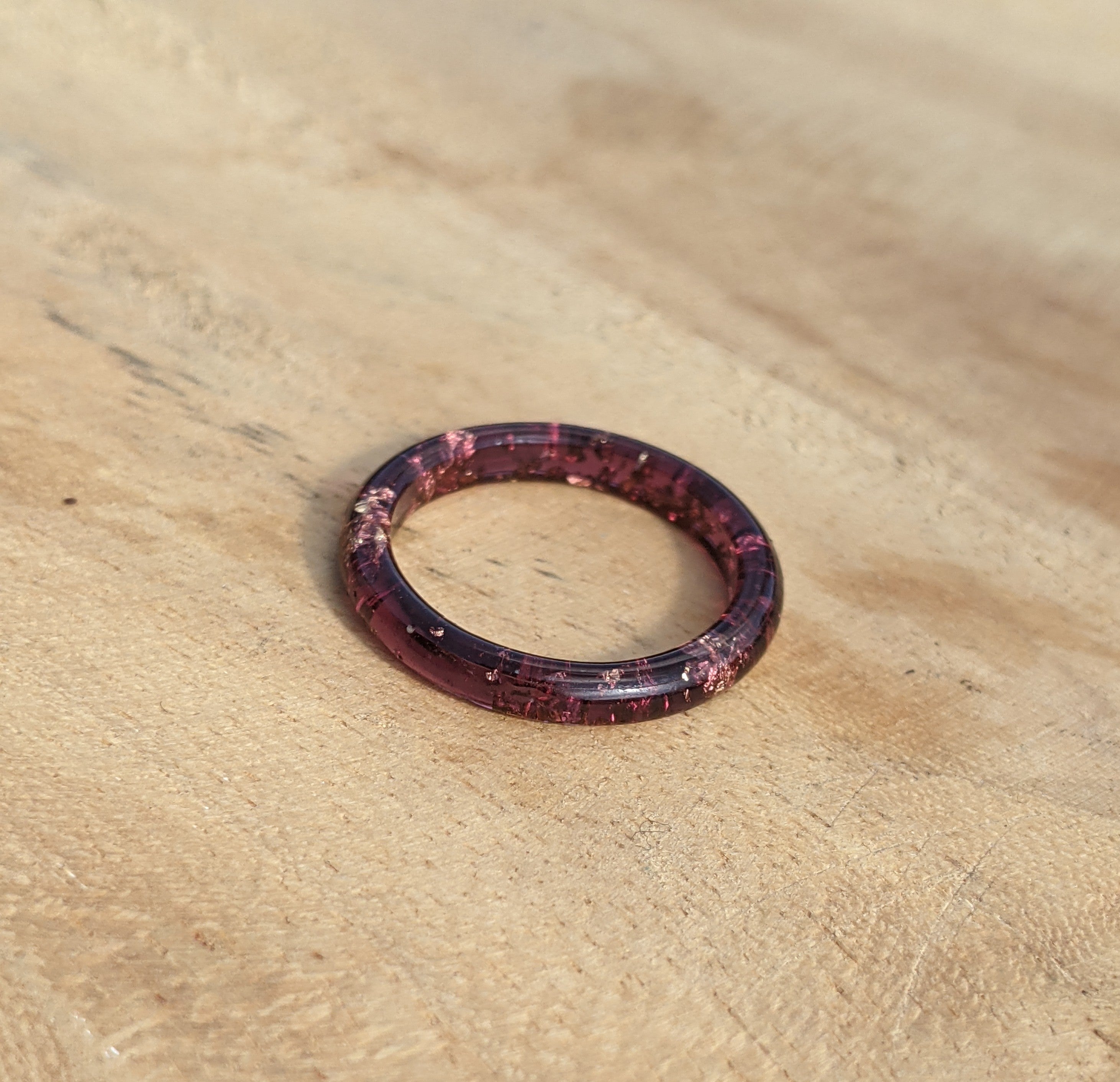 Purple ring on a wooden surface