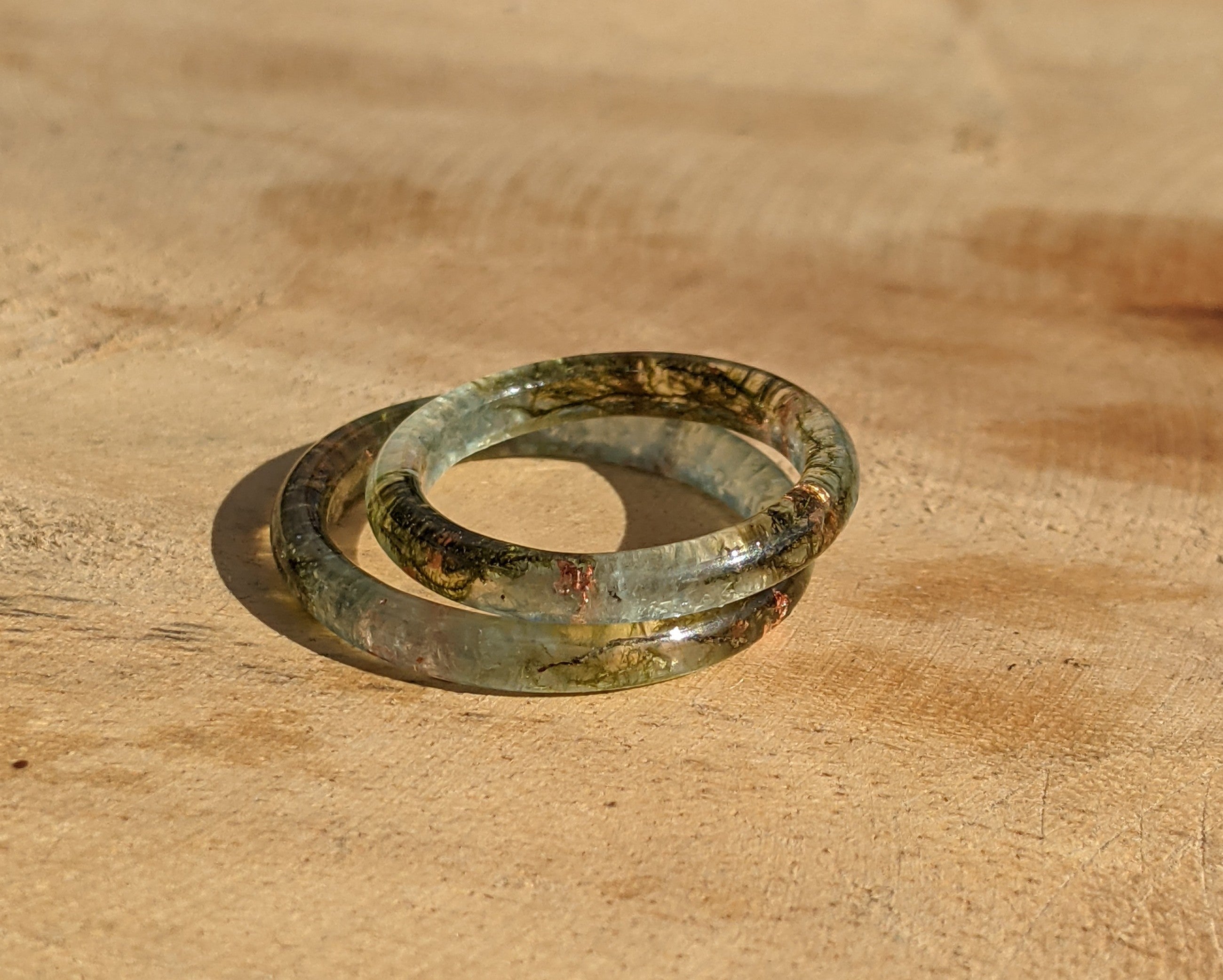 Ancient glass ring on a wooden surface