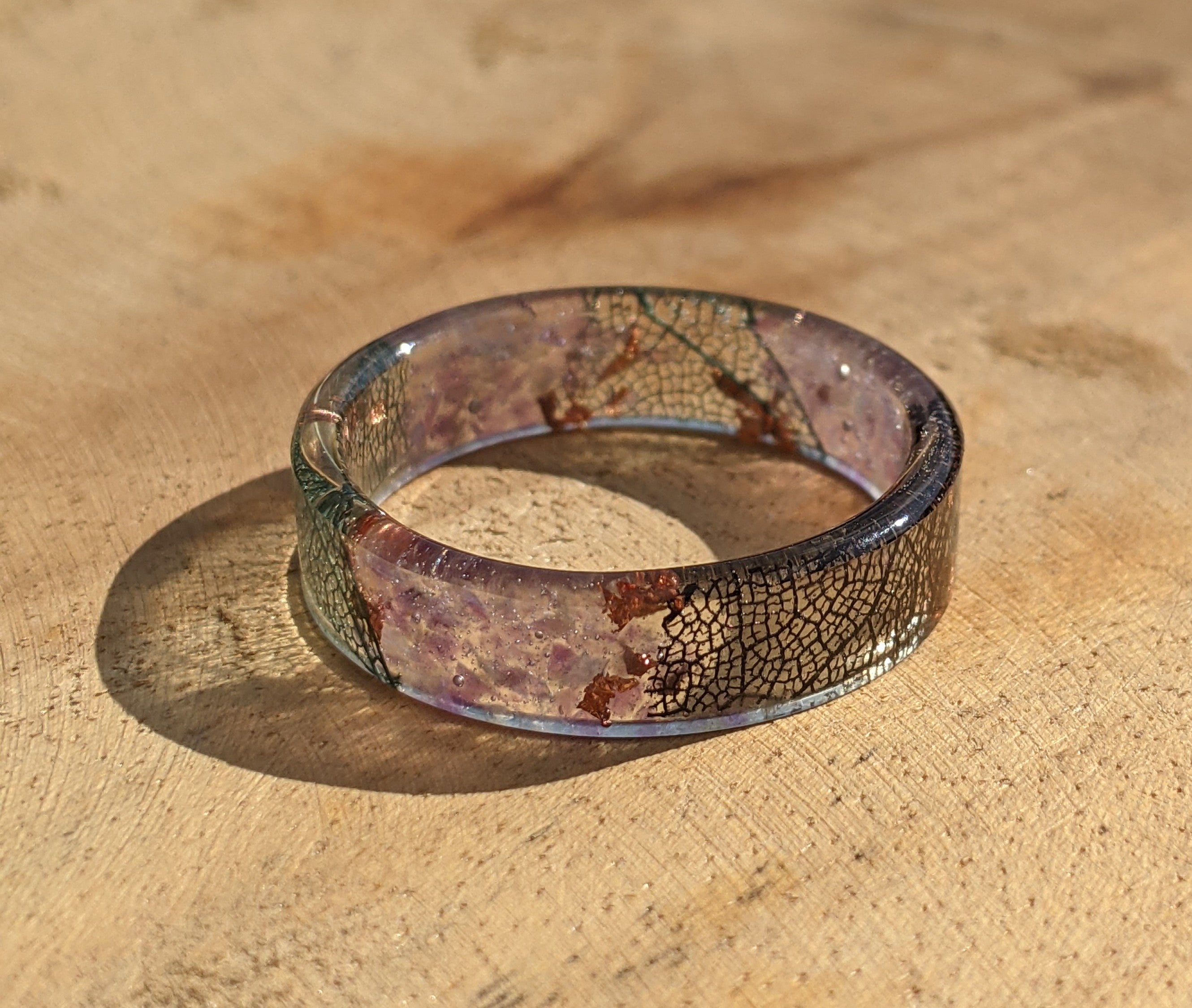 Decorative resin ring on a wooden surface