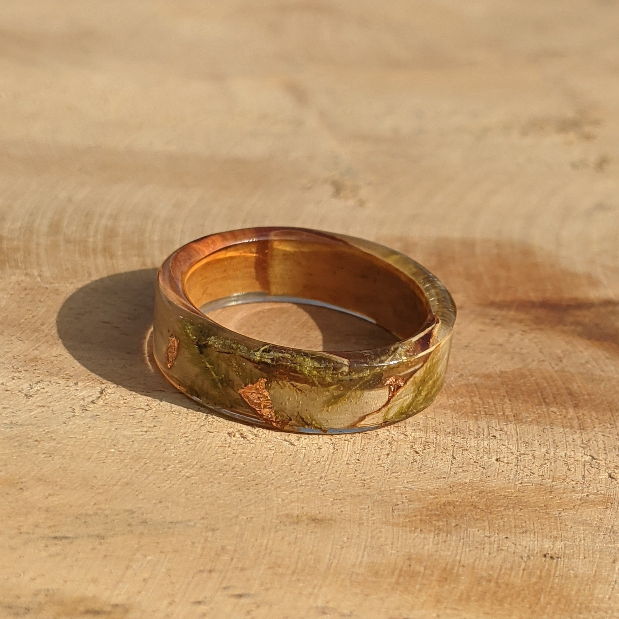 Gold ring on a wooden surface