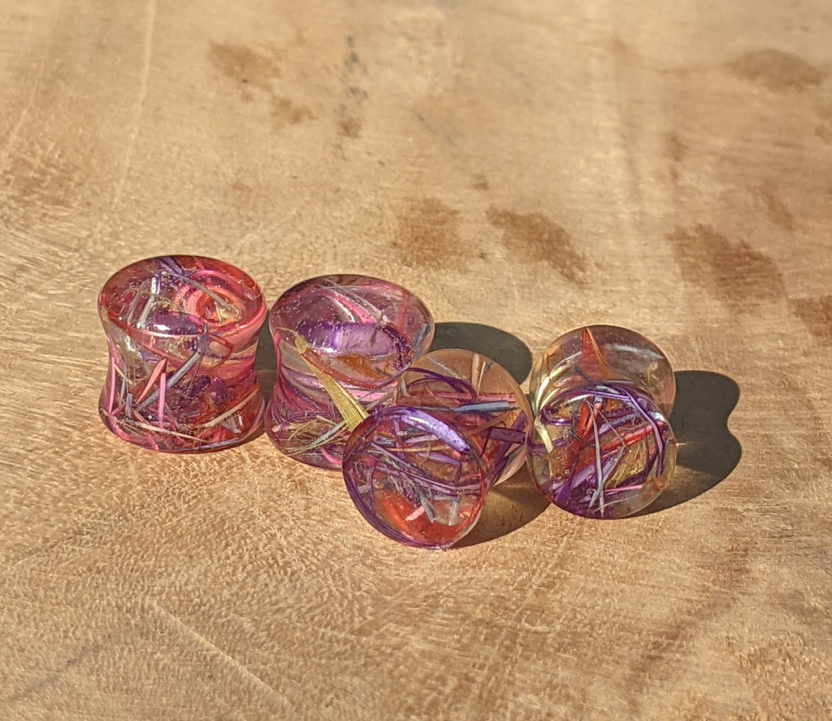 Handmade resin ear gauges with real rainbow feathers EL-Creations