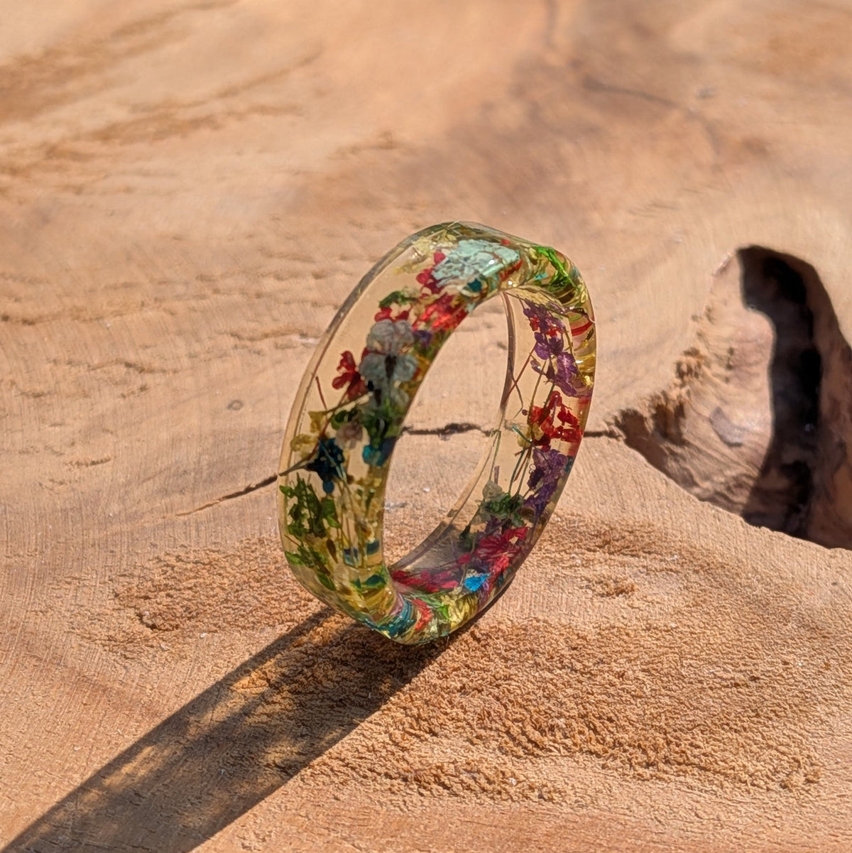 Botanical garden resin ring featuring preserved wildflowers by EL-Creations