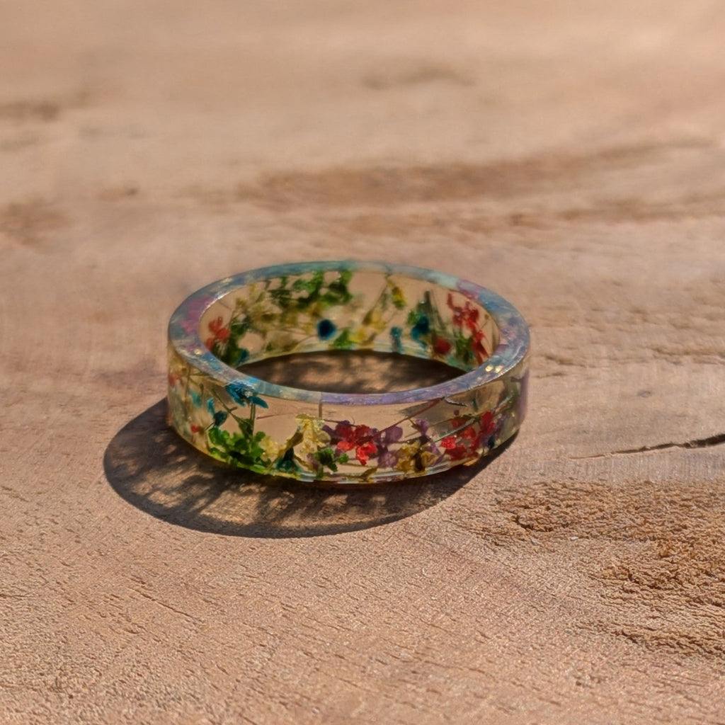 Floral-patterned ring on a wooden surface