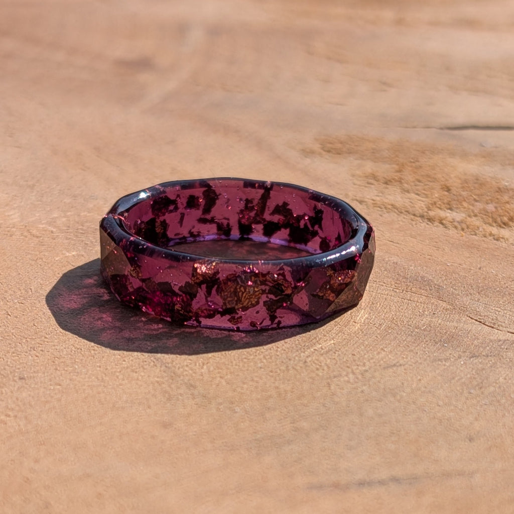 Hexagonal purple and black patterned dish on a wooden surface
