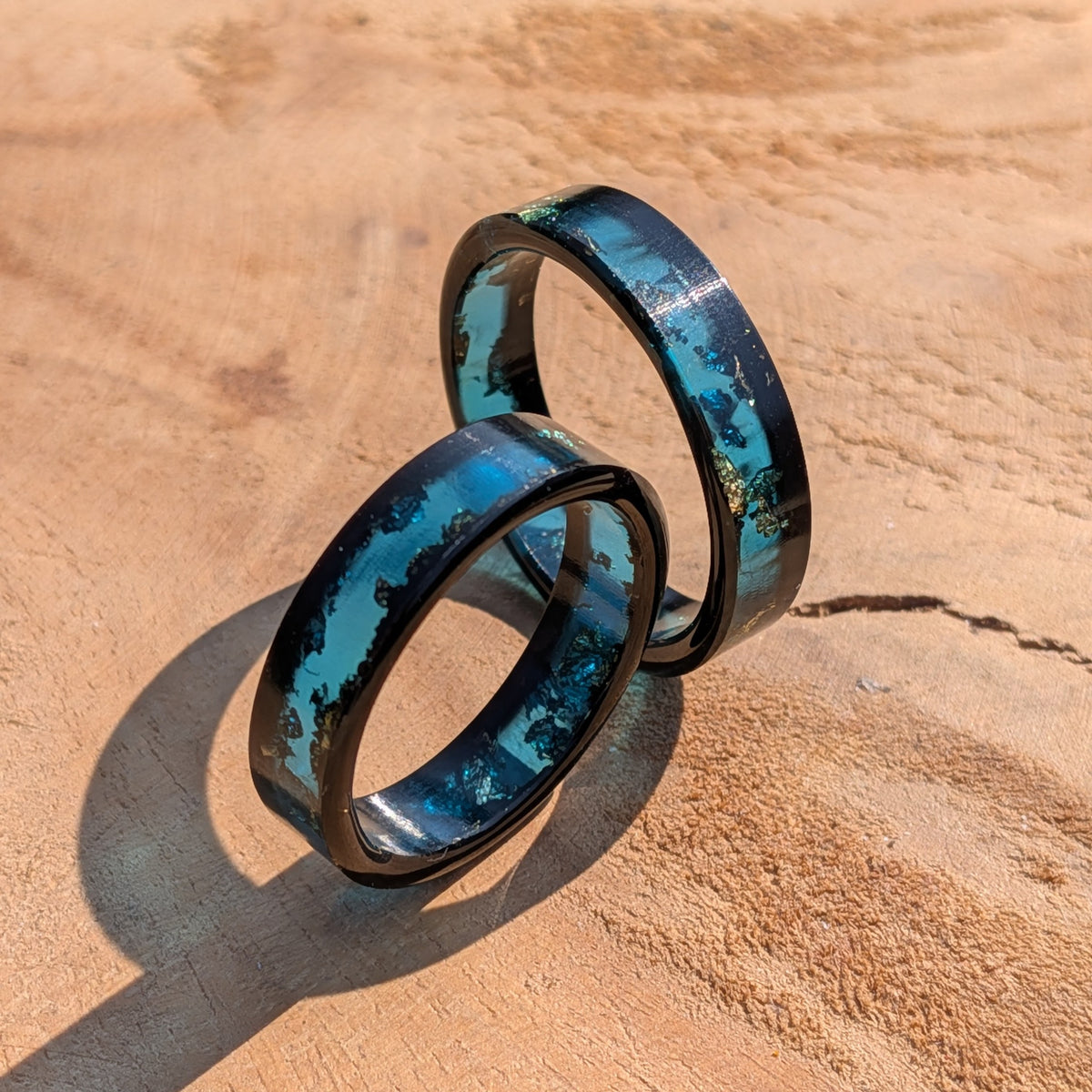 Glossy black and blue resin band with shimmering metallic accents by EL-Creations