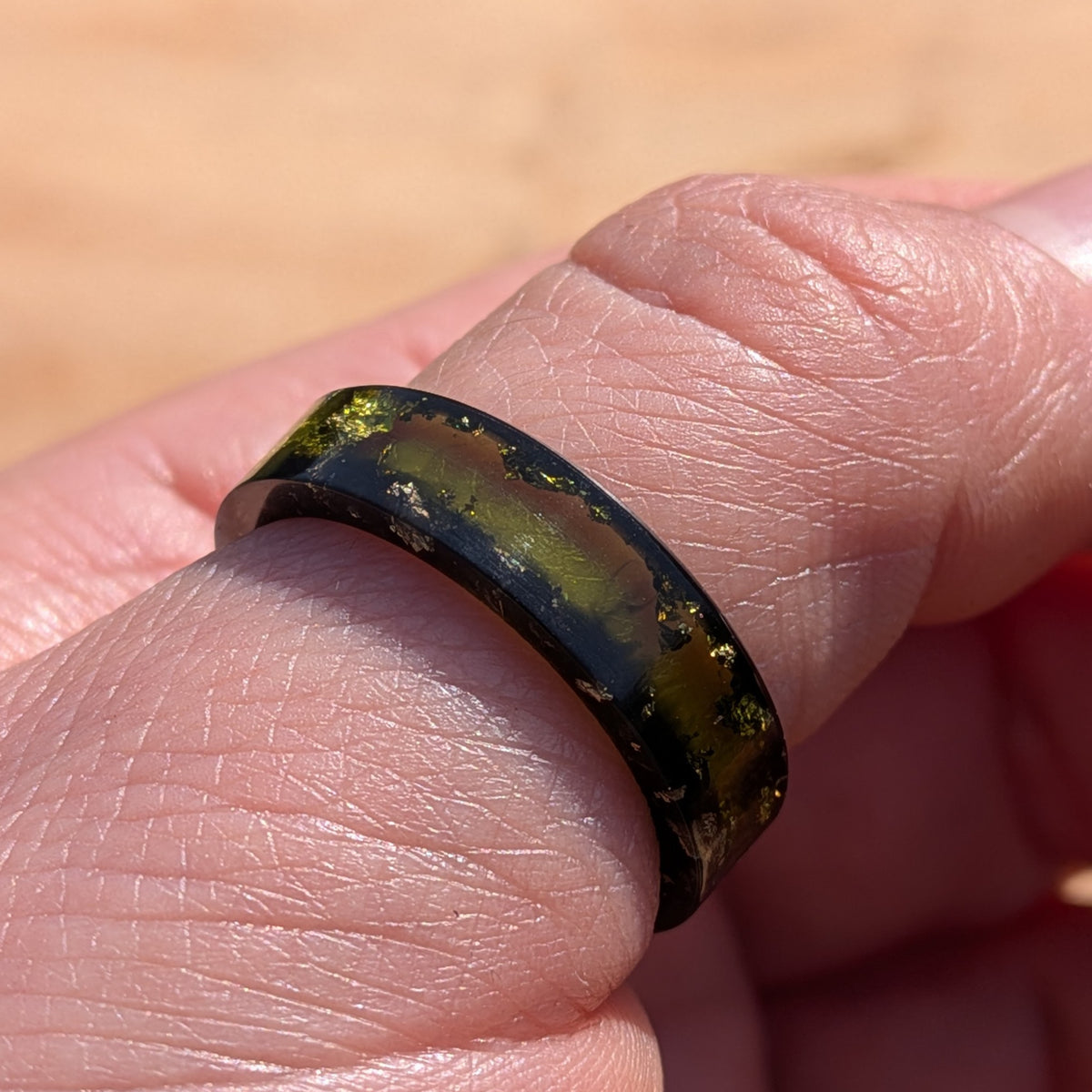 Contemporary green resin ring with metallic gold details by EL-Creations