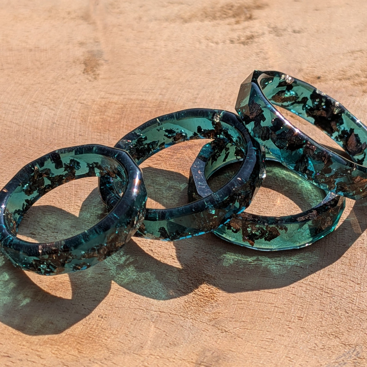 Glossy sage resin ring featuring metallic copper accents by EL-Creations