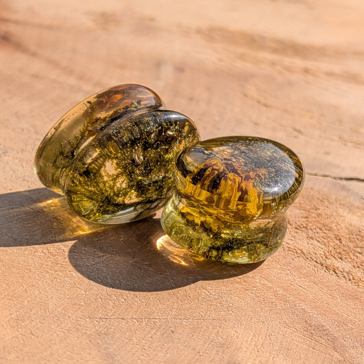 Handmade teardrop ear plugs featuring yellow green moss in resin EL-Creations