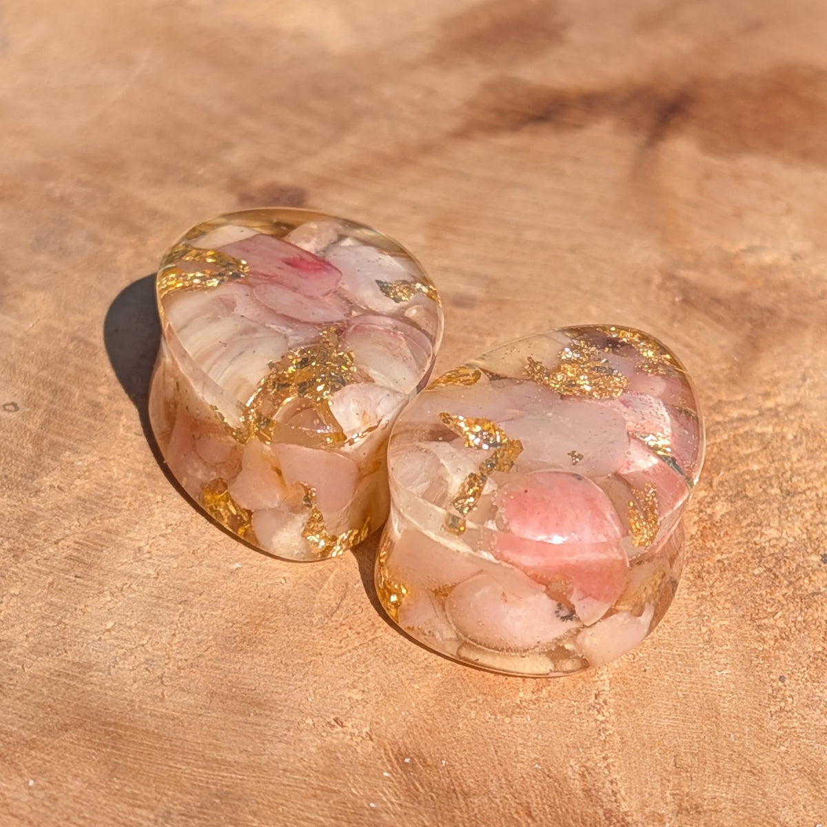 Close up of genuine rose quartz preserved in resin with gold flakes EL-Creations