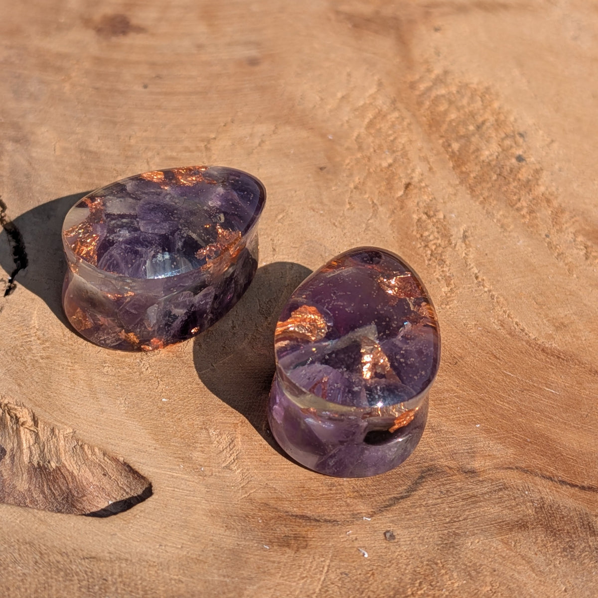 Close up of genuine amethyst and copper flakes preserved in resin EL-Creations